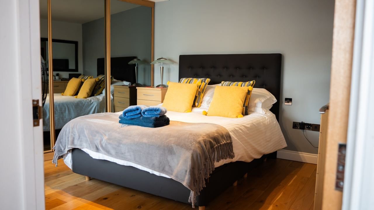 Double bedroom with fresh linens and bedside tables