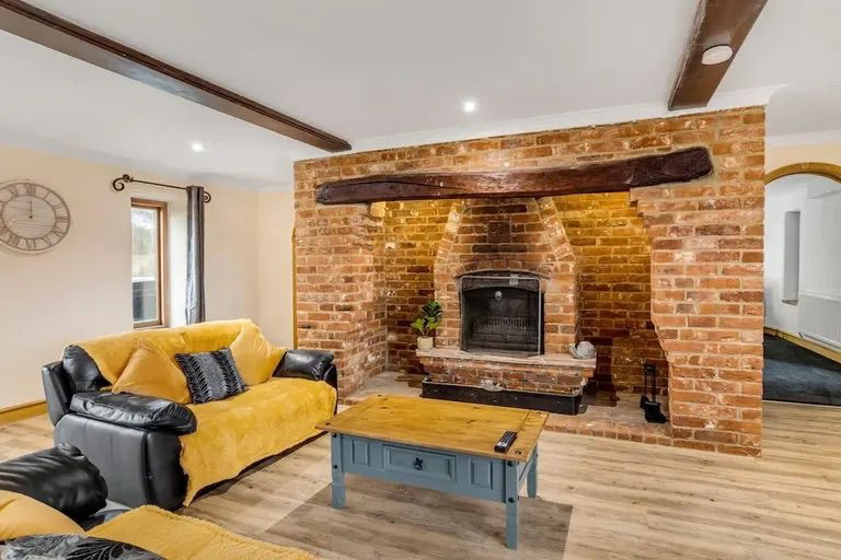 Cozy lounge with fireplace and comfortable seating